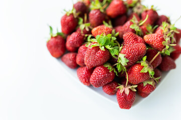 Ripe picked strawberries on the table. Collection of fresh organic strawberries. Delicious and sweet berry.
