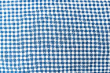 Fabric, tablecloth in blue check, can be used for background.