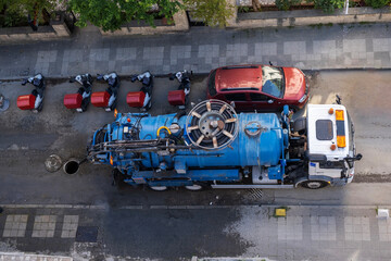 top view of sewer cleaning vacuum truck. Selective Focus Vehicle. On Street.