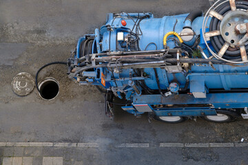 top view of sewer cleaning vacuum truck. Selective Focus Vehicle. On Street. - obrazy, fototapety, plakaty