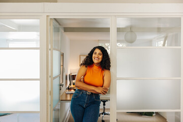 Happy young businesswoman smiling at the camera