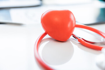 Red heart ball with stethoscope on hospital background: Hospital Life Insurance Concept: World...