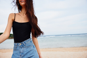 young woman sea lifestyle smile summer running travel beach sunset beautiful