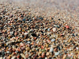 Natural sea pebbles, wet pebbles, small pebble background