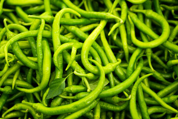 Green chilli close-up. Fresh Vegetables Background. Chili peppers.
