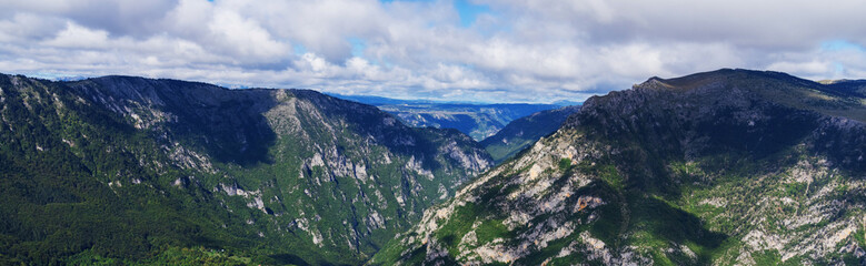 Fototapeta na wymiar Panorama of mountain peaks. A beautiful screensaver for the site. Amazing nature.