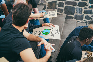 Protesters prepare banners before marching for Climate Change demontration - Focus on banner