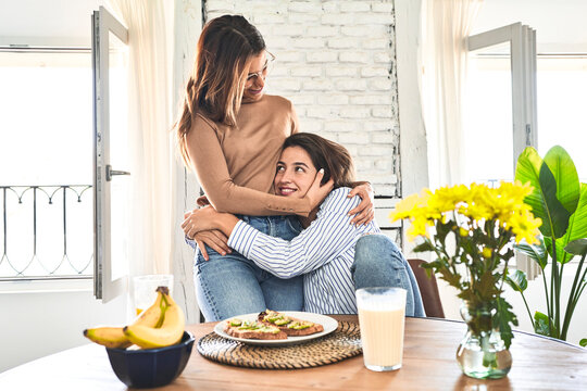 Grateful embrace: heartfelt breakfast, cherished moment.