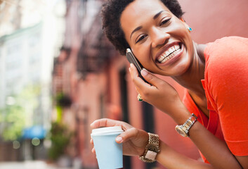 Woman on cell phone on city street