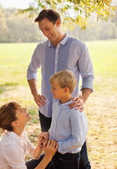 Fototapeta premium Family relaxing together in park