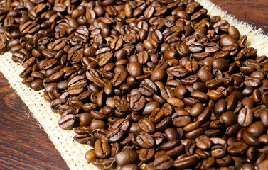 Coffee beans on burlap. Arabica is the most common type of coffee.