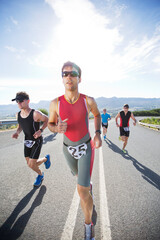 Runners in race on rural road