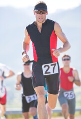 Fototapeta premium Runner in race on rural road