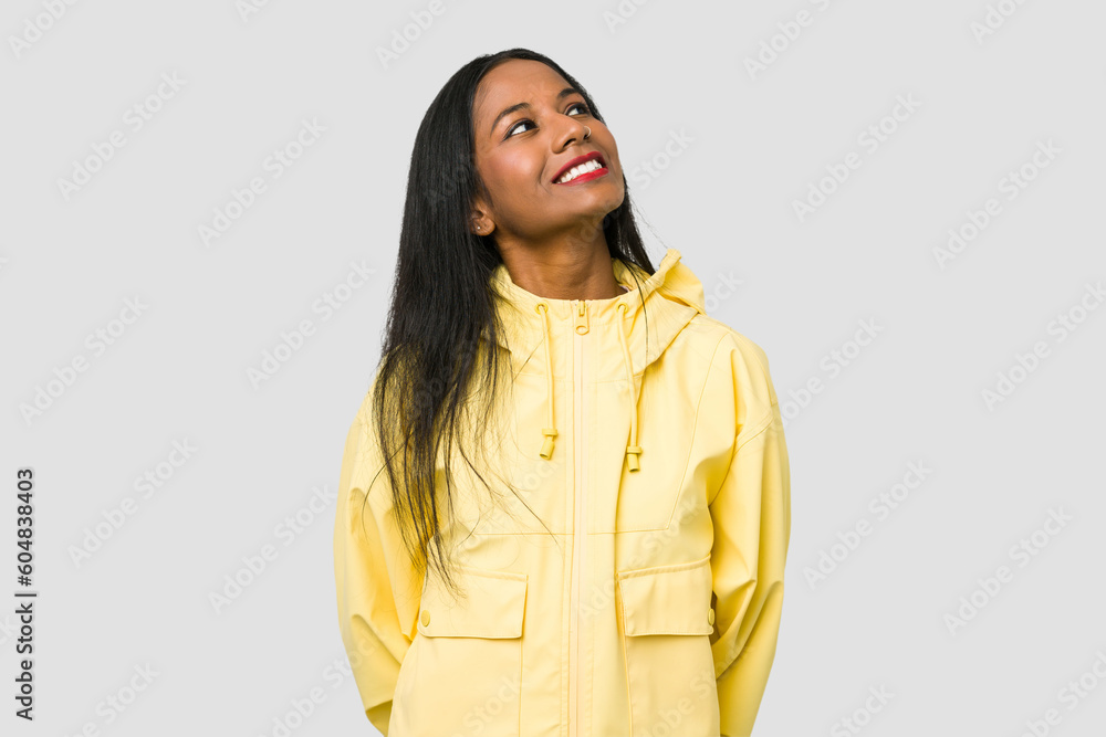 Wall mural Young Indian woman cut out isolated on white background relaxed and happy laughing, neck stretched showing teeth.