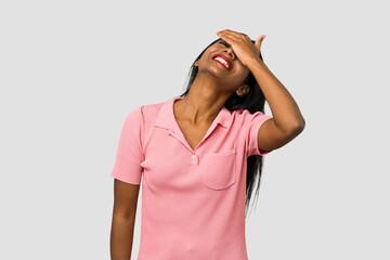 Young Indian woman cut out isolated on white background laughs joyfully keeping hands on head. Happiness concept.