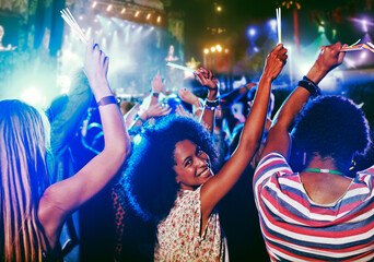 Portrait of cheering woman at music festival