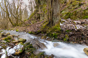 Harz's Flowing Symphony: Long Exposure of a Wild River Embraced by Rocks