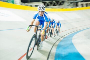 Track cyclist racing in velodrome