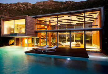 Swimming pool and modern house at night