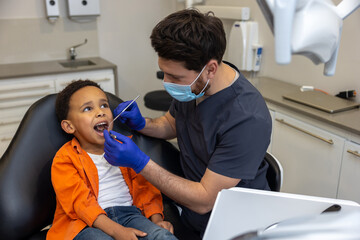 Male doctor in mask checking up his patient
