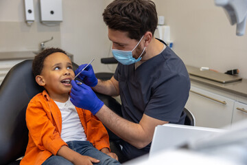 Male doctor in mask checking up his patient