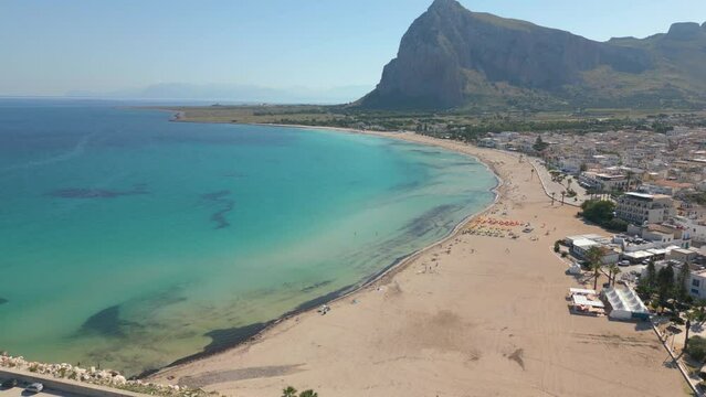 This aerial drone video shows the town of San Vito Lo Capo in Northern Sicily, Italy. The mediterranean town has a beautiful beach. 
