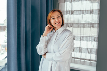 Middle age brunette business woman. Beautiful serious caucasian business woman. Female leader, manager or CEO with a smile, mission and vision. Leadership, management and success with a woman boss