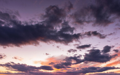 Fototapeta premium dramatic cloudscape at dusk. sky in colorful evening light. changing weather forecast