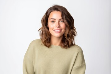 Obraz premium Medium shot portrait photography of a glad girl in her 30s wearing a cozy sweater against a white background. With generative AI technology