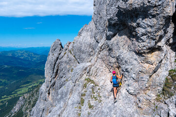 Silhouette of via ferrata/klettersteig female climber