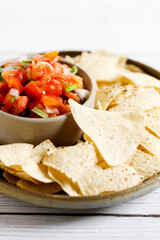 Tomato salsa with tortilla chips.