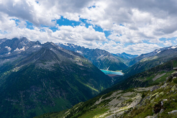 Fototapeta premium Beautiful view of Lake Schlegeis in the Austrian Alps during the summer, European touristic vacation destination
