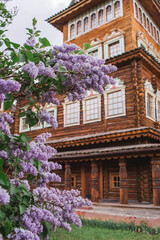 Fototapeta na wymiar Beautiful, fluffy lilac on the background of the palace of Tsar Alexei Mikhailovich in Kolomenskoye. Russia, Moscow, May 2023