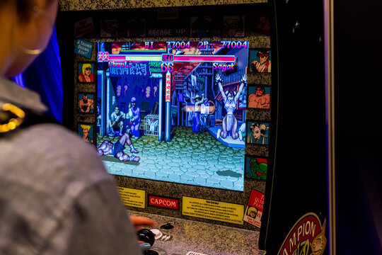 Warsaw, Poland - May 21, 2023: Someone is playing Street Fighter arcade game