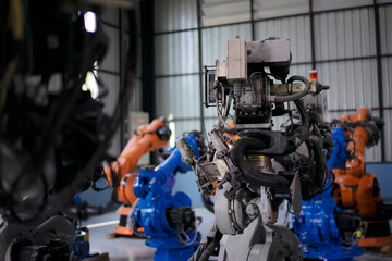 Engineer work at robotic arm factory.