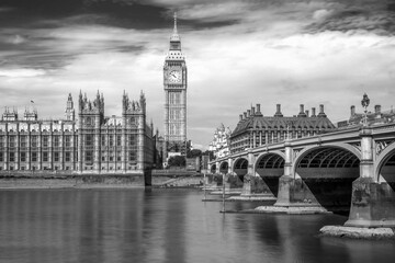 Westminster bridge and Big Ben in London, UK. Long exposure black and white photography with motion blur.