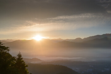 Fototapeta na wymiar The sun was just above the ridgeline. Capture the sunrise and sea of clouds here. Jinlong Mountain, Nantou, Taiwan