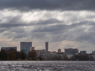 Fototapeta premium Hamburg Alster Canal drive with a view to the Boat and City