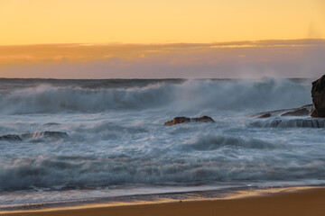 Sunrise and Waves - Surf's up at the seaside