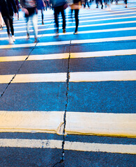 Busy people on zebra crossing street in Hong Kong