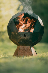Burning fire pit in the garden
