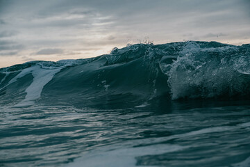 Sun behind the high wave in the ocean, naturalism, chillwave