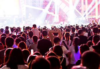 Group of people are watching a rock concert