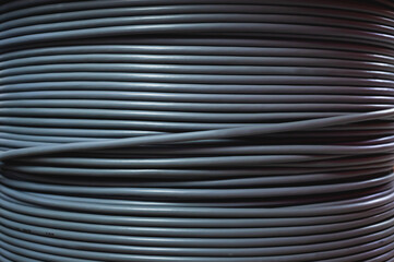 Close-up of a cable bay. Coiled cable in a polymer winding in a storage warehouse of a...