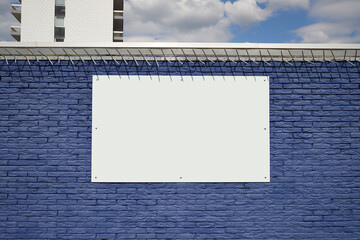 Textured blue bricks wall and blank frame