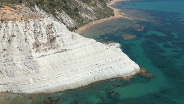 This aerial drone video shows the beautiful coastline of the Turkish Stairs, also named Scala dei Turchi. This natural wonder can be found at the coast of Sicily, southern Italy.