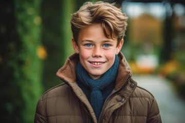 Fototapeta premium Headshot portrait photography of a grinning mature boy wearing a cozy winter coat against a botanical garden background. With generative AI technology