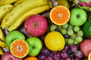 Naklejka na ściany i meble assorted fruits, top view healthy food concept Including high vitamin fruits, fresh fruits, thai fruits
