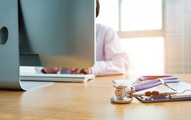 Fototapeta premium Doctor at work with a stethoscope on desk