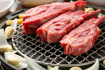 mutton being cooked over charcoal 숯불위에 익어가고 있는 양고기